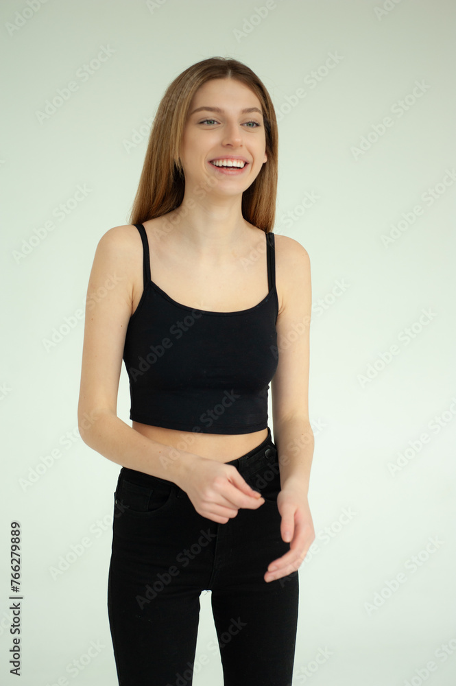 Snap Models. Full length portrait of a beautiful brunette woman in black bikini isolated on white background Snap Models. Full length portrait of a beautiful brunette woman in black bikini isolated on white background