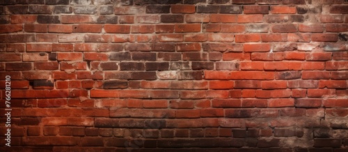 A detailed view of a brown brick wall with a blurred background, showcasing the beautiful brickwork and shades of red. The texture resembles an artistic design with hints of wood grain