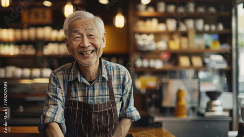 Cheerful elderly man with an infectious smile behind the counter of a traditional cafe.