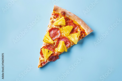 Appetizing slice of Hawaiian pizza on a blue background and space for text