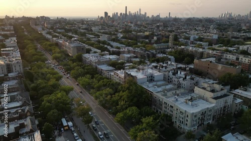 Brooklyn drone footage. Aerial descending footage. Multistorey apartment houses in city. New York City, USA View over the residential district of Bushwick, Brooklyn, at sunset photo