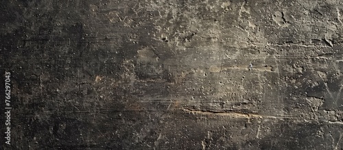 A closeup photo of a concrete wall showcasing its textured surface. The pattern resembles wood grain, adding an artistic touch to a buildings exterior