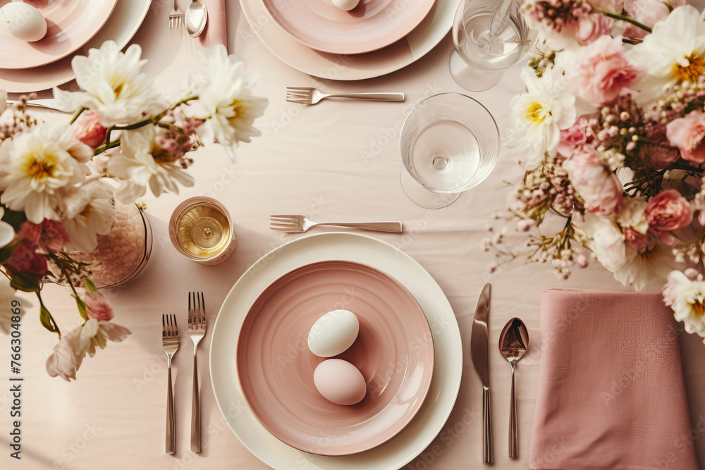 Table set with pink plates, silverware, flowers, and eggs Table set with pink plates, silverware, flowers, and eggs