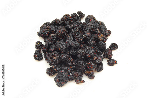 Dry black mulberry pile isolated on white background.