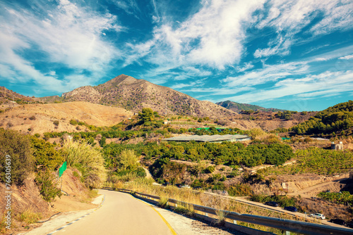 Obraz na płótnie Southern region of Spain. Country road in the mountains. Agriculture greenhouses on the mountain slopes. Descent to Maro beach. Maro, Nerja, Spain w salonie
