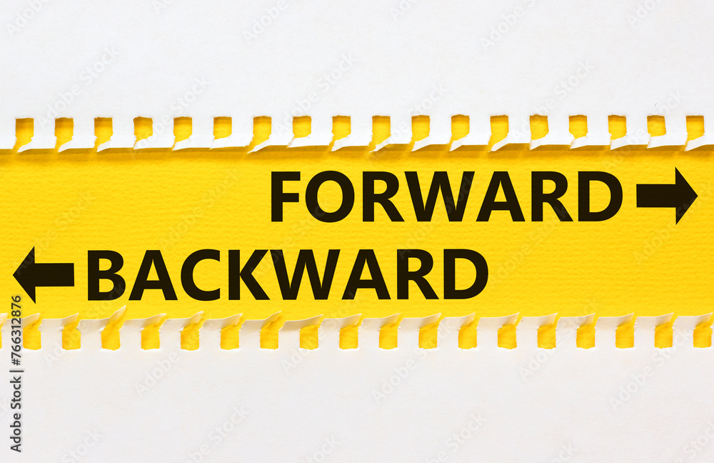 Obraz premium Forward or backward symbol. Concept word Forward or Backward on beautiful yellow paper. Beautiful white paper background. Business forward or backward concept. Copy space.