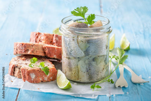 Healthy and tasty pickled fish with herbs and onion.