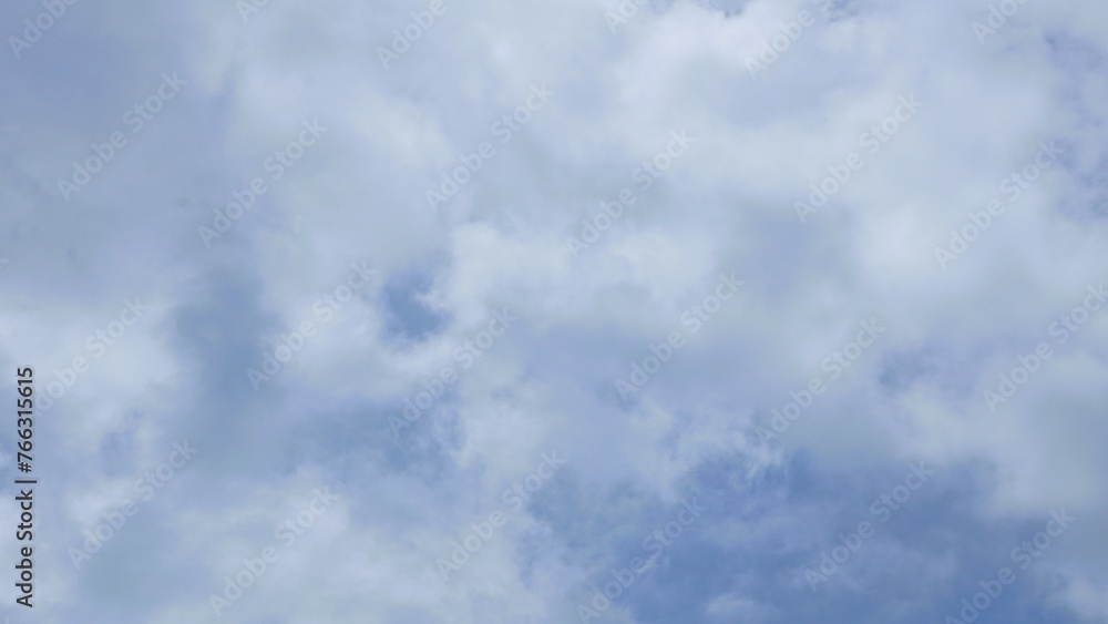 Ornamental clouds. Dramatic sky. Epic cloudscape. Soft sunlight. Panoramic image, texture, background, graphic resources, design, copy space. Meteorology, heaven, hope, peace concept