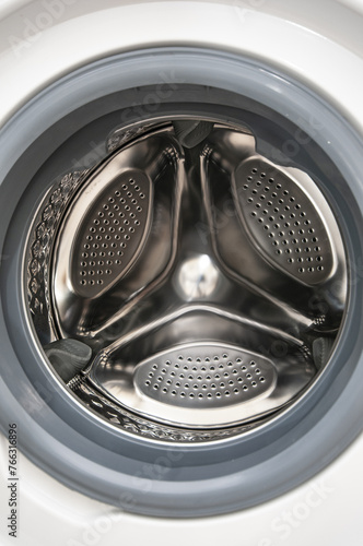 Inside view of empty washing machine close up