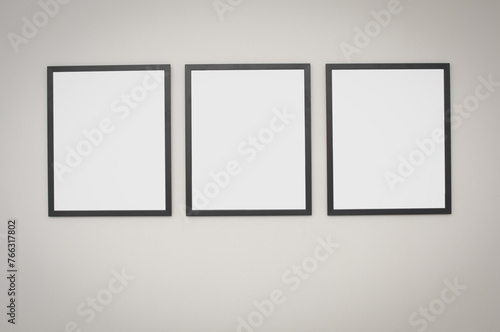 Three  blank frame on a gray wall