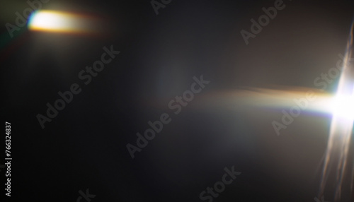Real Lens flare light effect. Sparkle ray leak on black background. Optical effect of spotlight. Flash leak beam.