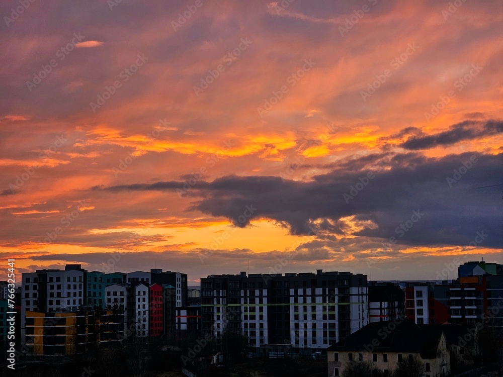Beautiful sunset over the city. Colored clouds at sunset. Sunset over city Beautiful sunset over the city. Colored clouds at sunset. Sunset over city