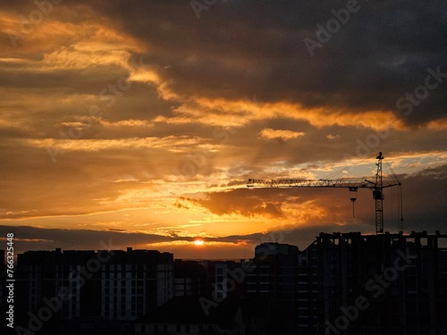 Beautiful sunset over the city. Colored clouds at sunset. Sunset over city