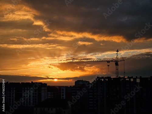 Beautiful sunset over the city. Colored clouds at sunset. Sunset over city