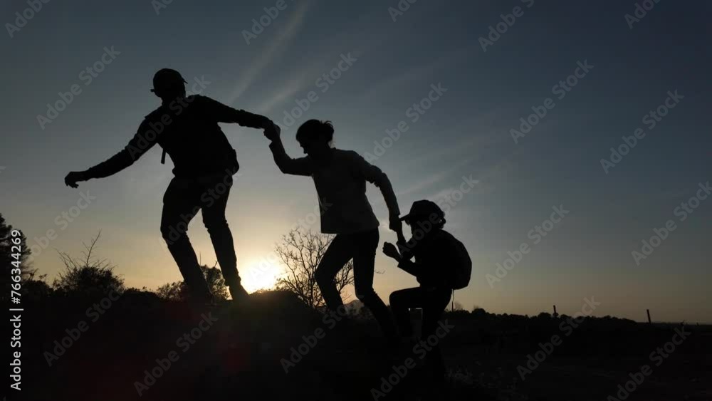 Mother father help children in mountain silhouette sunset concept grow help education i achievements in life with family i care Mother father help children in mountain silhouette sunset concept grow help education i achievements in life with family i care