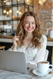 Businesswoman, female digital nomad or freelancer working on a laptop in a cozy cafe. Productivity and tranquility, as the person blends work and relaxation in a comfortable environment.
