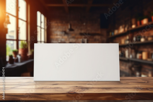 Empty white stand, sign for menu and advertising on a wooden table against the background of a bar, kitchen, cafe, store.Mock up