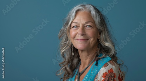 Elderly Woman Smiling in Blue Studio Setting Captured with Canon EOS D Mark IV Generative AI photo