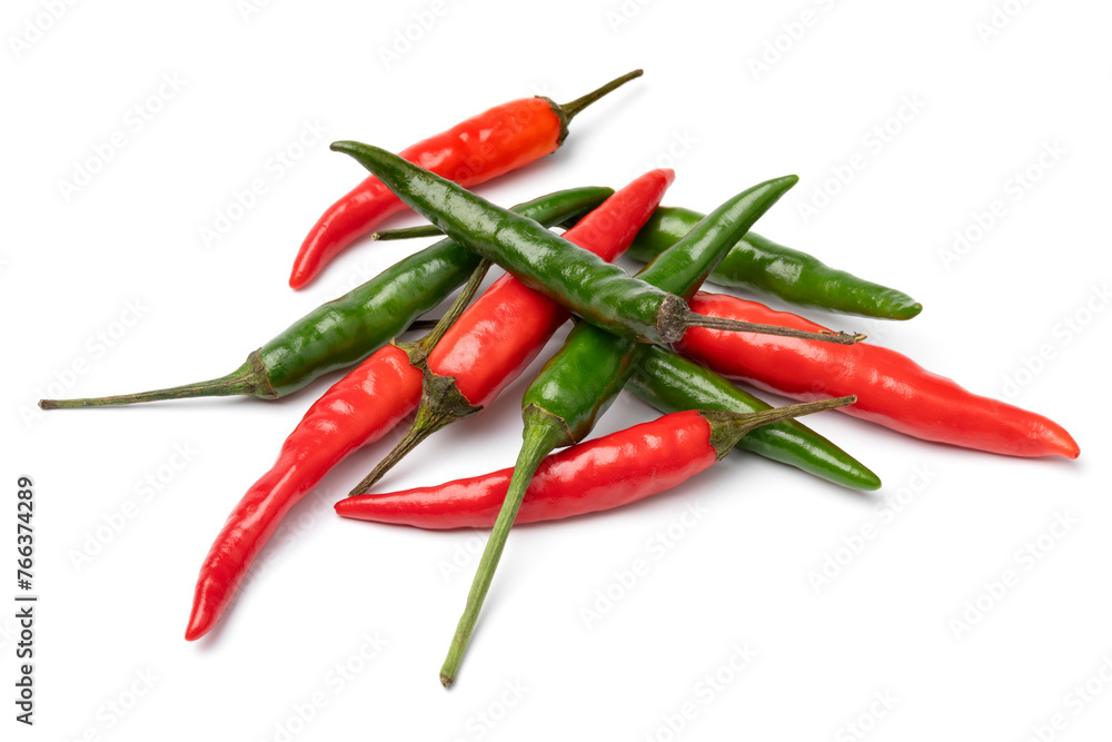 Heap of whole fresh raw green and red rawit peppers close up isolated on white background