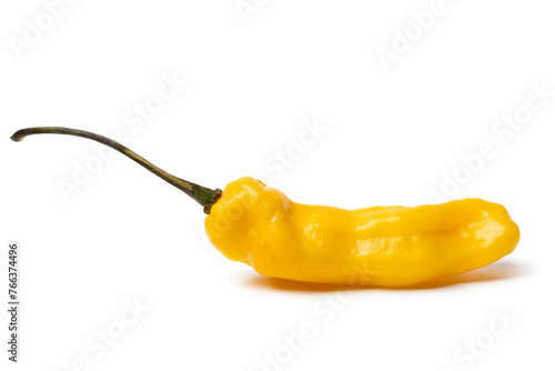 Single whole fresh raw ripe yellow Madame Jeanette pepper close up isolated on white background