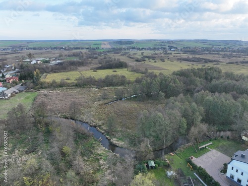 krajobraz wiejski, łąki i zielone użytki na wsi z lotu ptaka  photo