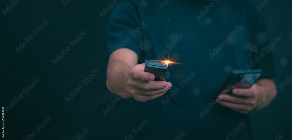 Fototapeta premium Concepts of using digital media, social media Surfing online, male hand using remote control To play or use social media, the concept of working remotely, working from home via the internet.