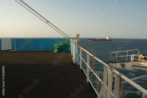 View of the vessel hardening metal plates on the bridge wing of a ship at sea © Antony