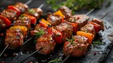 Grilled beef skewers with bell peppers, garnished with rosemary and spices on a dark stone background, ideal for barbecue parties or culinary websites