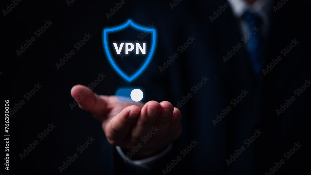 A man is holding a pill in his hand and the word VPN is displayed in blue A man is holding a pill in his hand and the word VPN is displayed in blue
