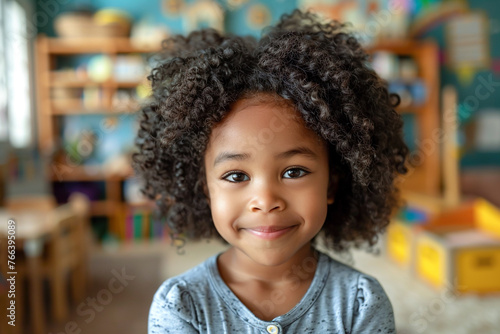 Kindergarten girl, African American child in school, joyful classroom activities. © Pavel