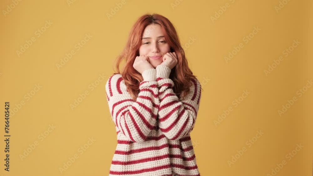 Cute girl with hands on face in studio on yellow background Cute girl with hands on face in studio on yellow background