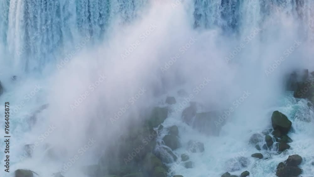 Aerial: Drone Downward Scenic View Of Famous Water Flowing On Rocks At Sunset - Niagara Falls, Canada
