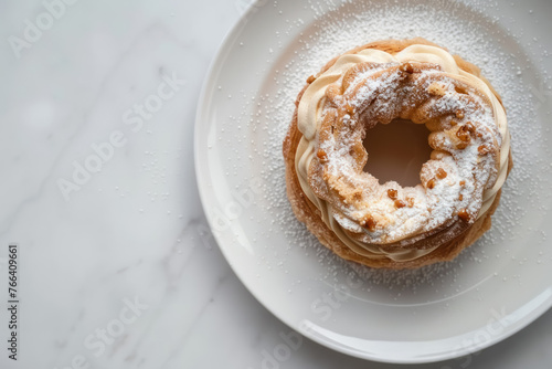  Over head paris brest with whipped cream on marble background