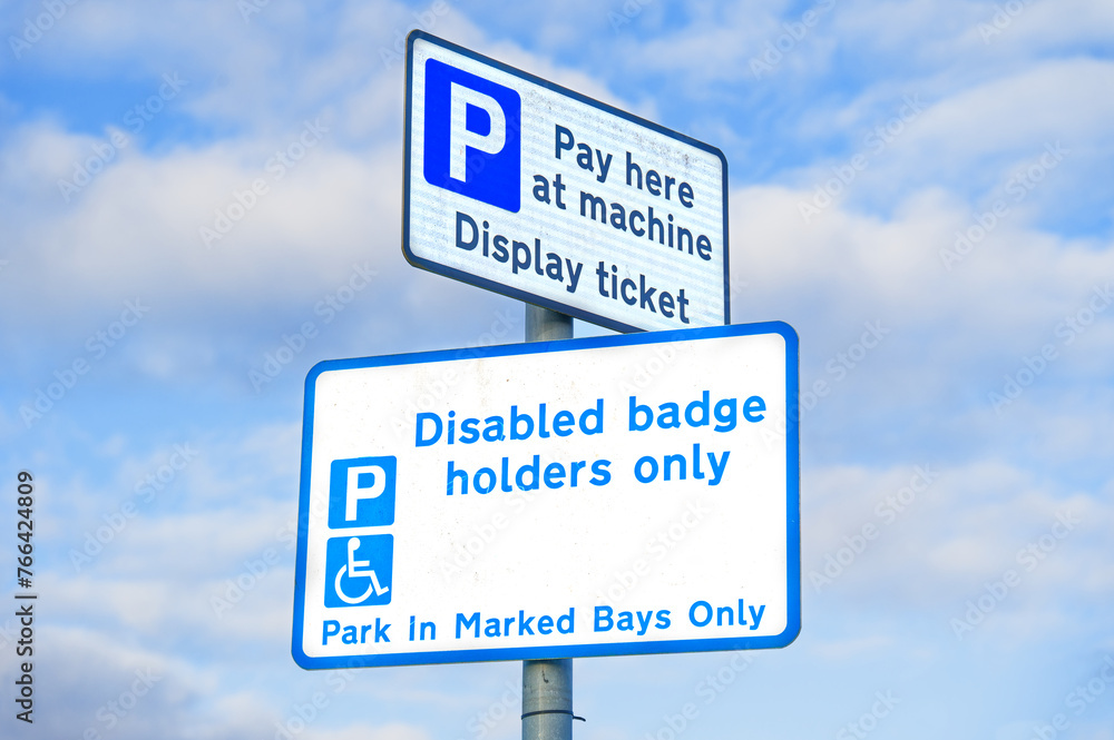 Fototapeta premium Disabled blue badge holder parking sign for driver 