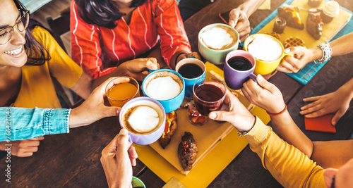 Group of people having fresh healthy breakfast sitting at bar table - Happy friends drinking cappuccino at cafe house open space - Food and beverage life style concept