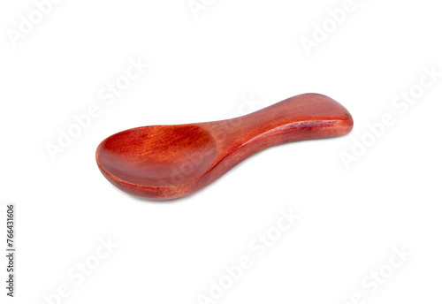 Small red wooden spoon for spice isolated on white background