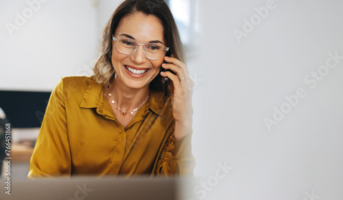 The call of success: Business woman making connections over the phone photo