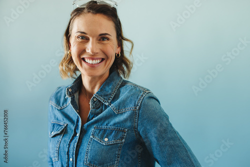 Confident and successful: Happy businesswoman in studio portrait photo