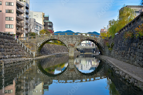 Meganebashi Brigde, a cultural landmark Nagasaki, Japan. The name comes from the water reflection of the two arches which look like glasses. Oldest stone arched bridge in Japan photo