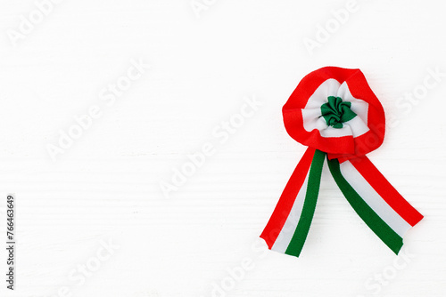 Fotografia Cockade isolated on white wooden background