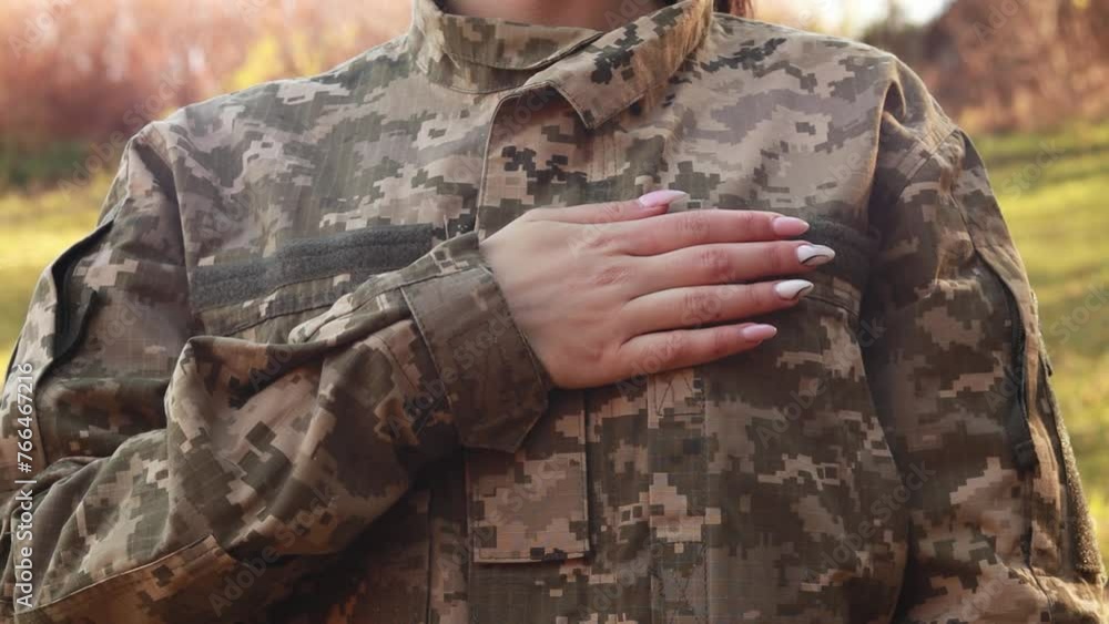 Female servicewoman brave soldier dressed in the camouflage military ...