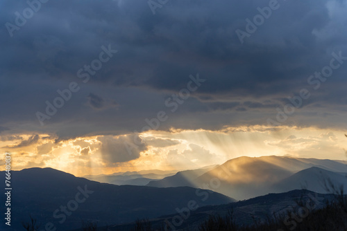 Albania, sunset between the clouds on the mountain with an amazing view