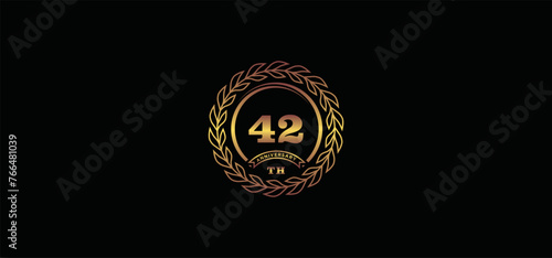 42st anniversary logo with ring and frame, gold color and black background photo