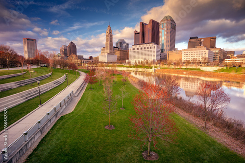 Columbus, Ohio, USA. Cityscape image of Columbus , Ohio, USA downtown skyline with reflection of the city in the Scioto River at spring sunset.
