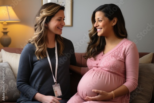 Pregnant woman consulting with a healthcare professional photo