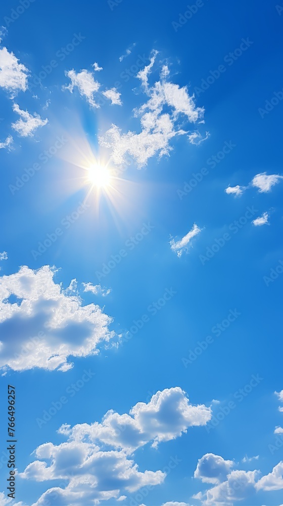 Blue sky with white clouds and bright shining sun