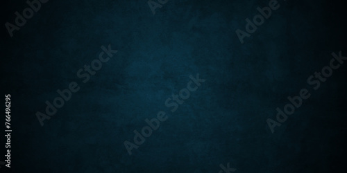 Dark and light blue grunge backdrop texture, watercolor painted mottled blue background, modern colorful concrete dirty smooth ink textures on black paper background. photo