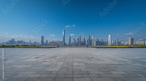 An empty city square with a modern cityscape in the background