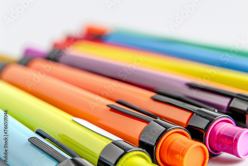 A collection of fine-tip markers, with a blank label on each marker for labeling purposes, isolated on a white background.