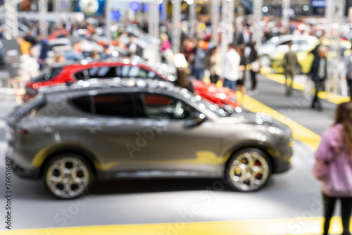 Blurred background of car show exposition. © scharfsinn86